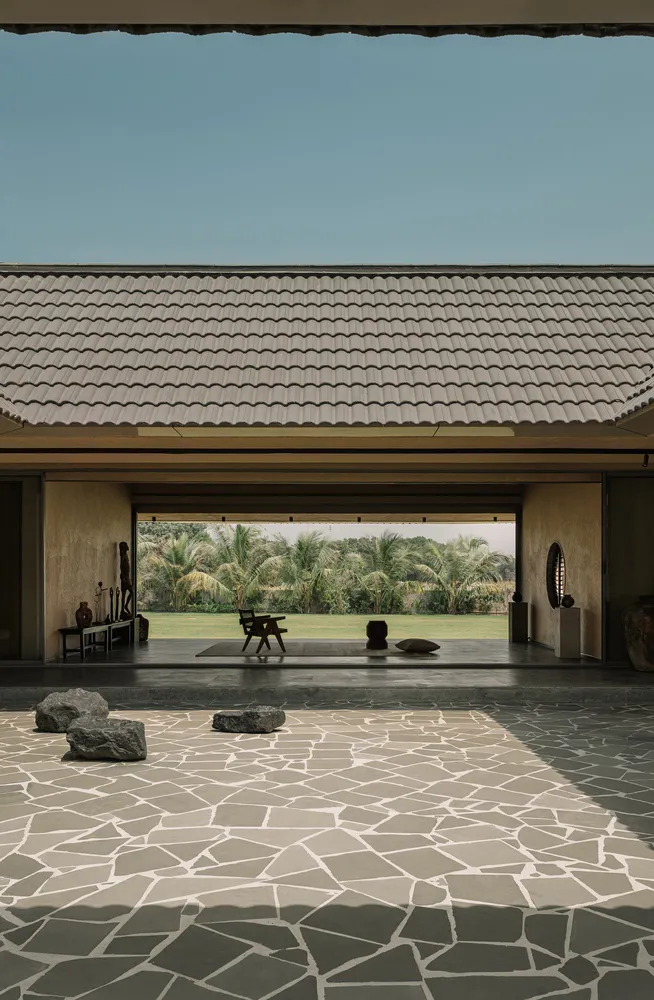 View of a minimalist residential interior with a combination of terrazzo and stone materials.