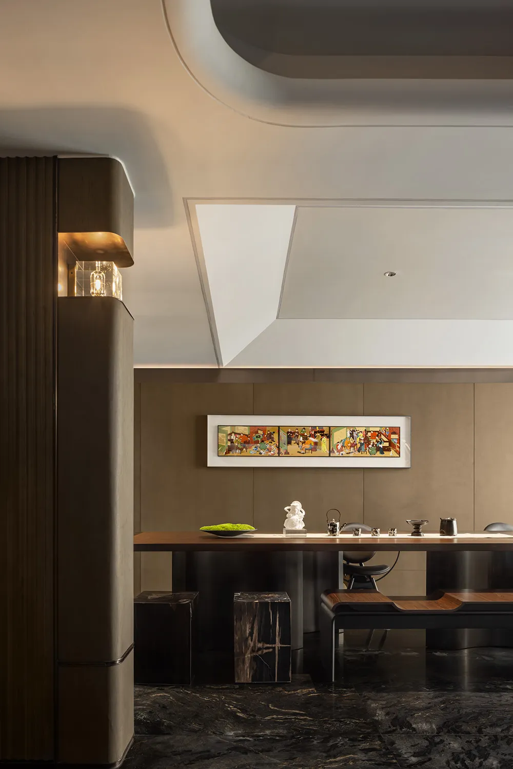 A modern dining room featuring wooden furniture and a large mural.