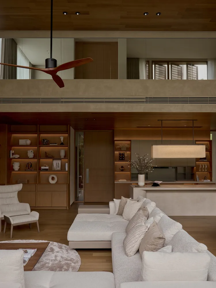 Minimalist living room with white furniture and wood accents