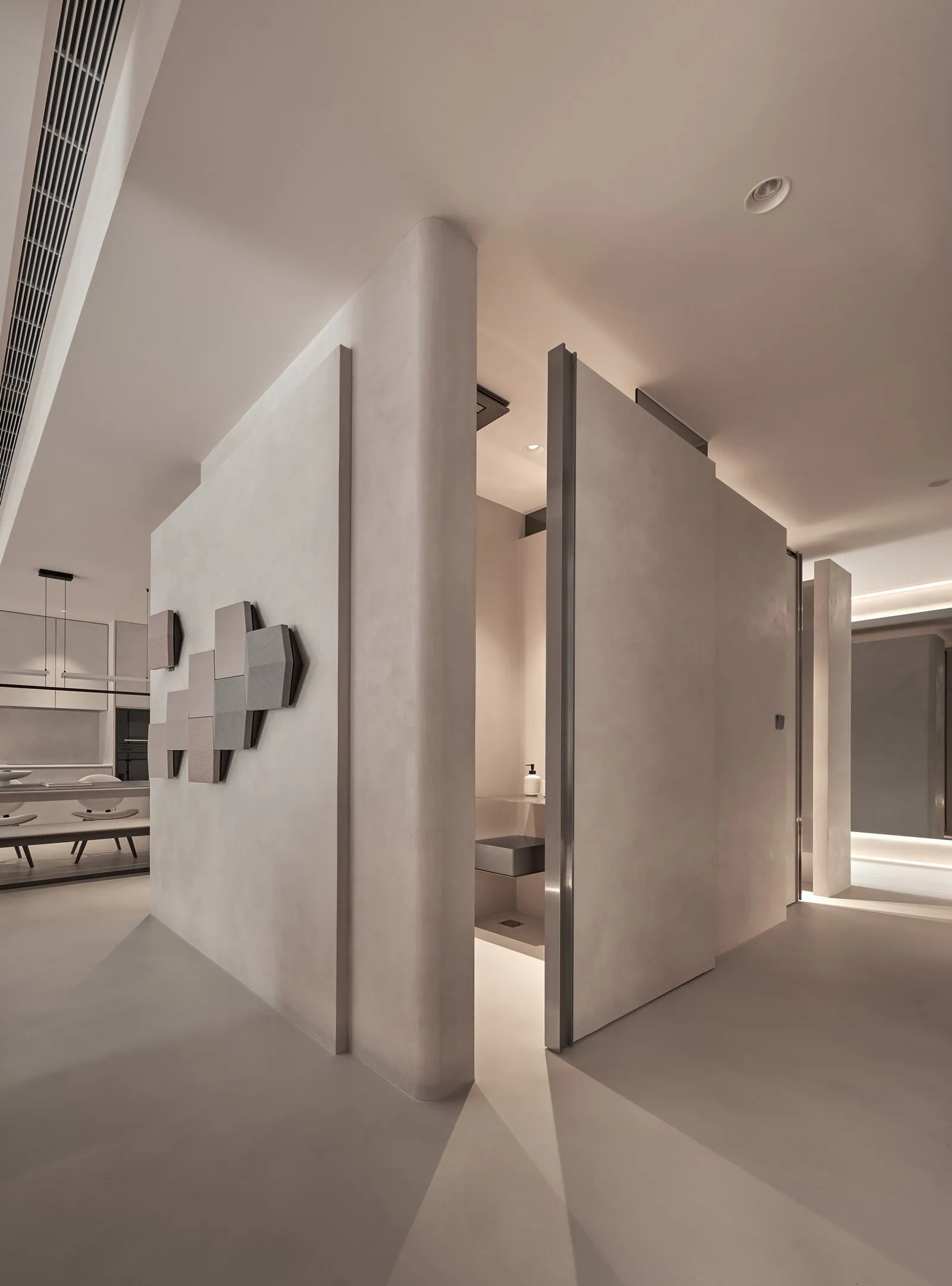 Modern living space with concrete walls and minimalist design elements.