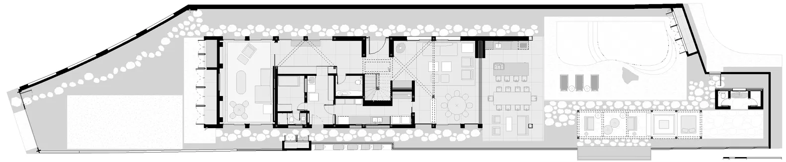 Floor plan of a modern house with concrete and glass materials.