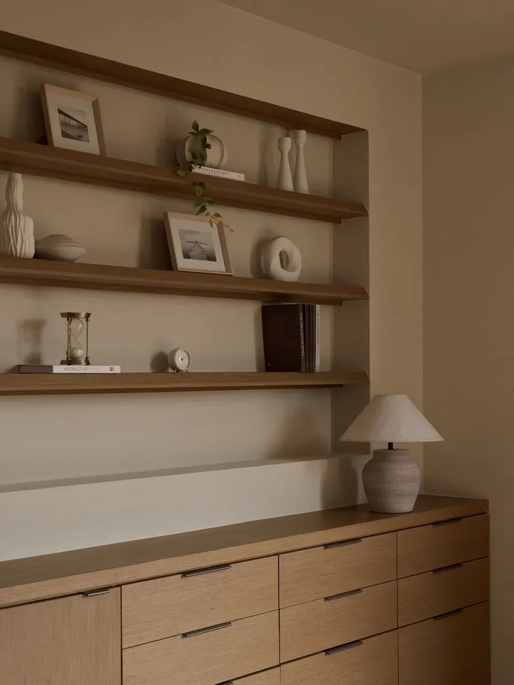 A modern minimalist office space featuring wooden furniture.