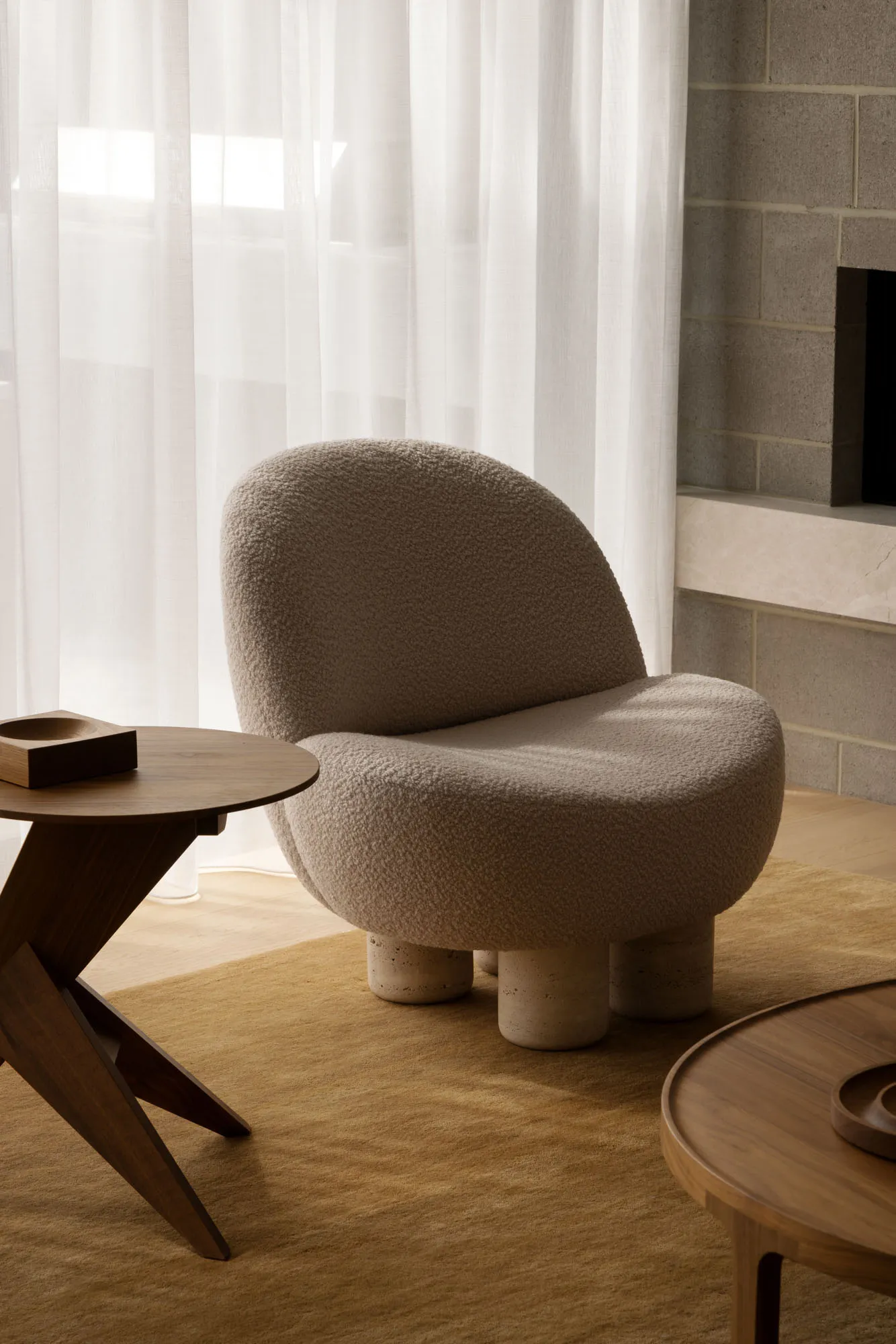 Modern living room with fabric furniture, minimalistic design and concrete legs.