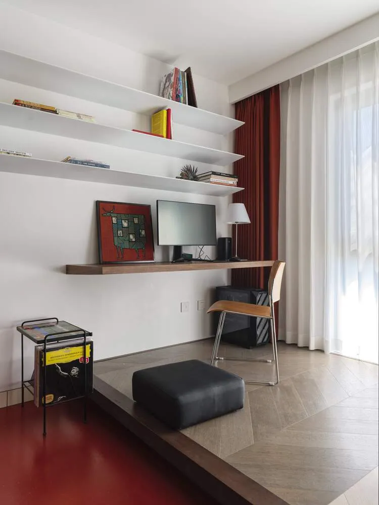 A modern living room featuring wood, leather, and metal elements.