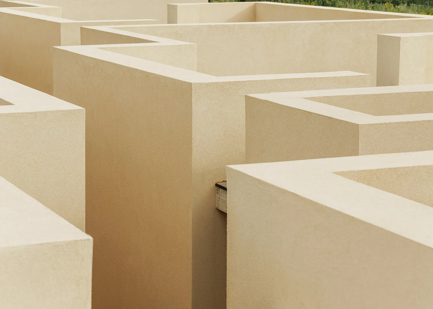 A minimalist concrete maze, featuring clean lines and geometric shapes.