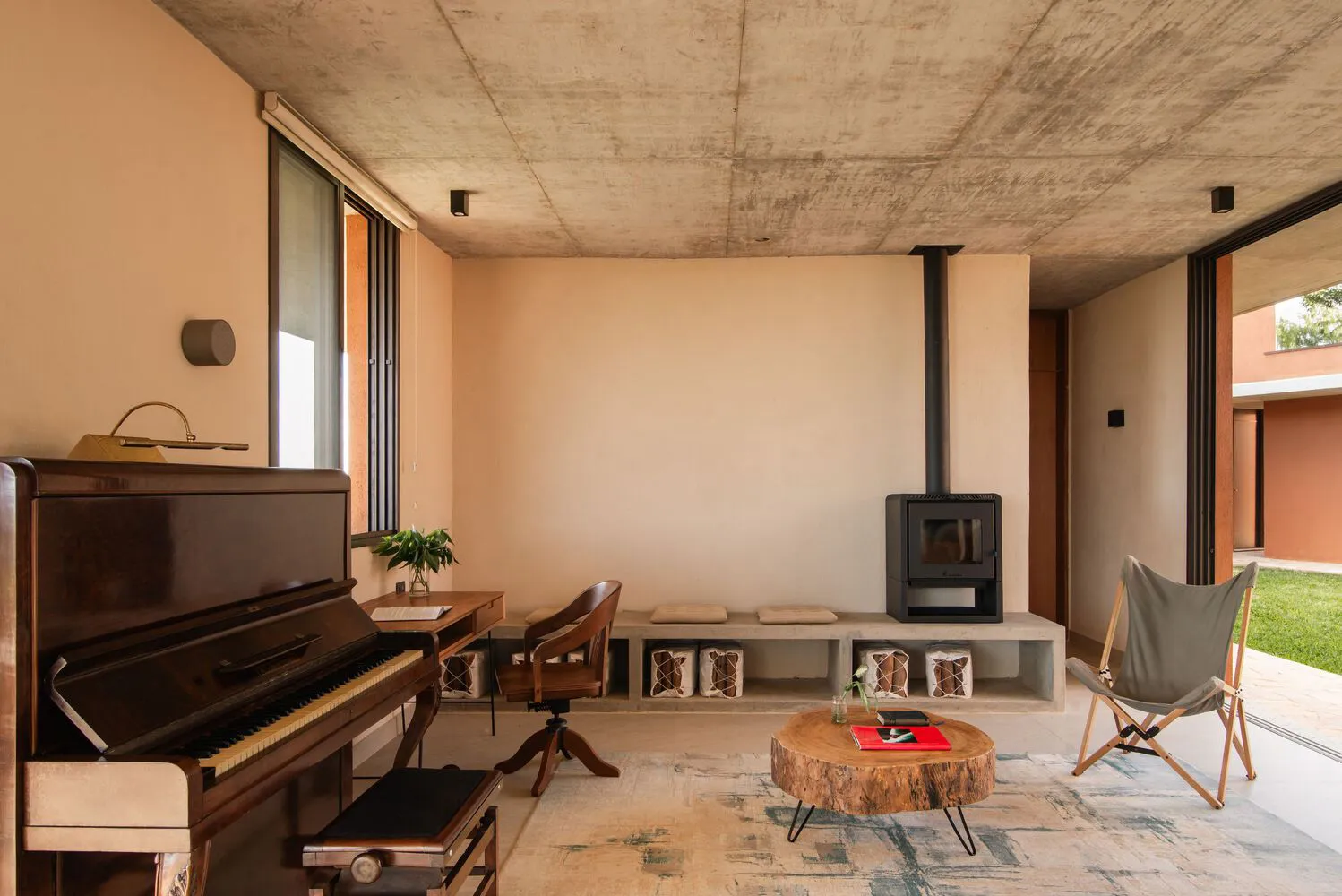 A modern living room with geometric furniture made of concrete materials.