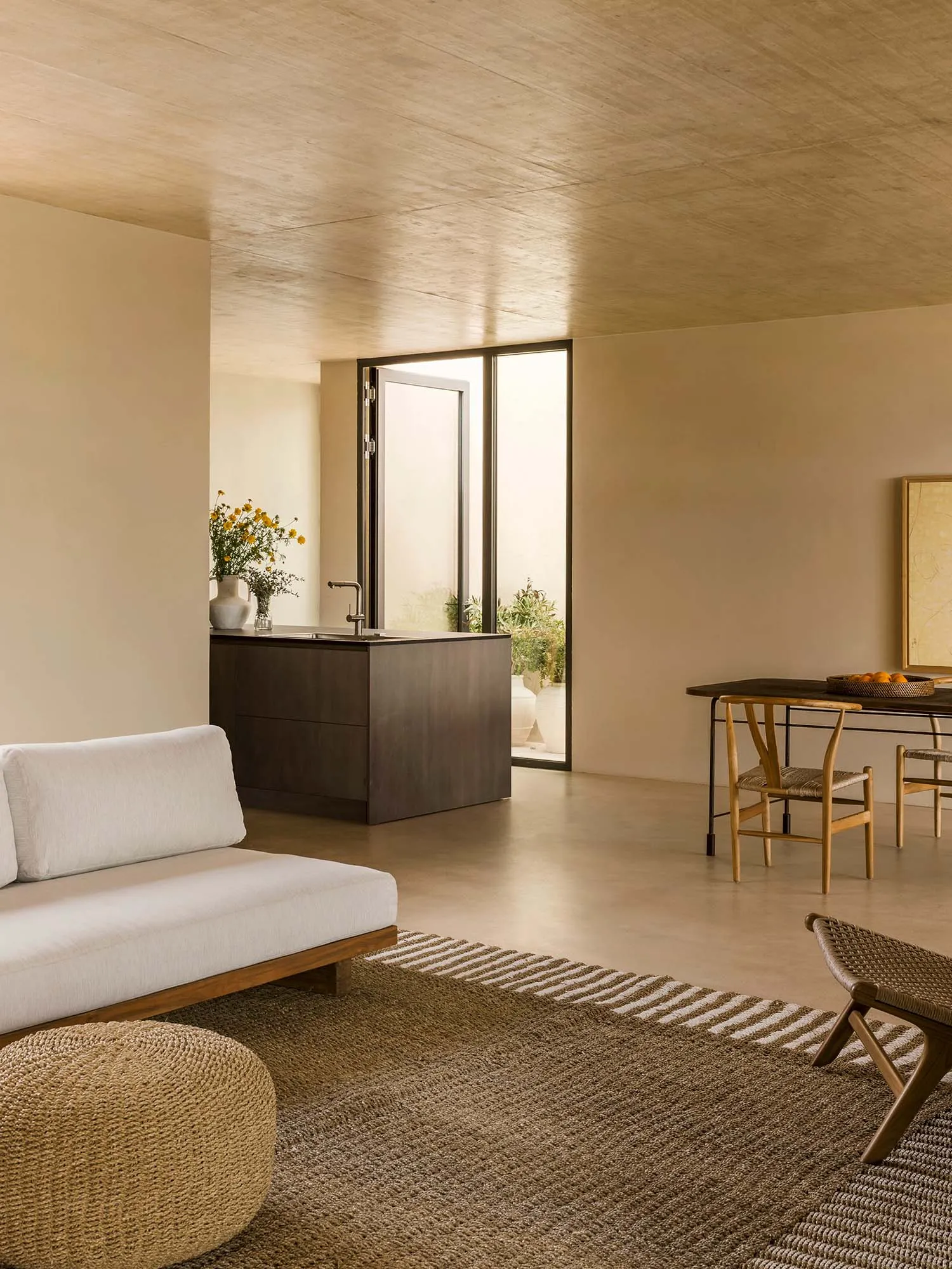 A modern minimalist living room with wooden elements and a neutral color palette.