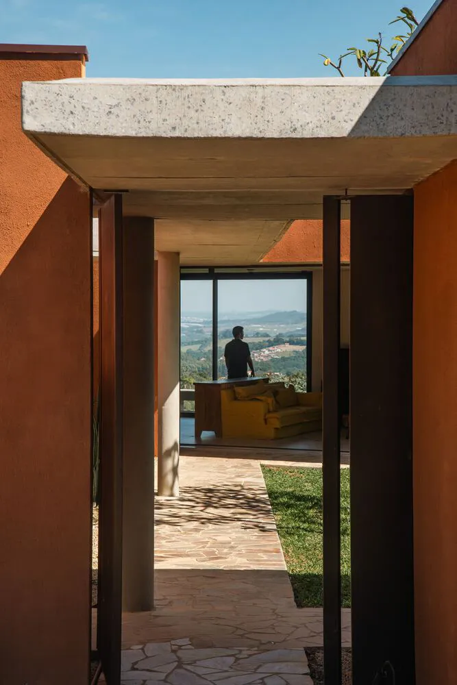 Concrete patio of a modern interior with a view of the outdoors.