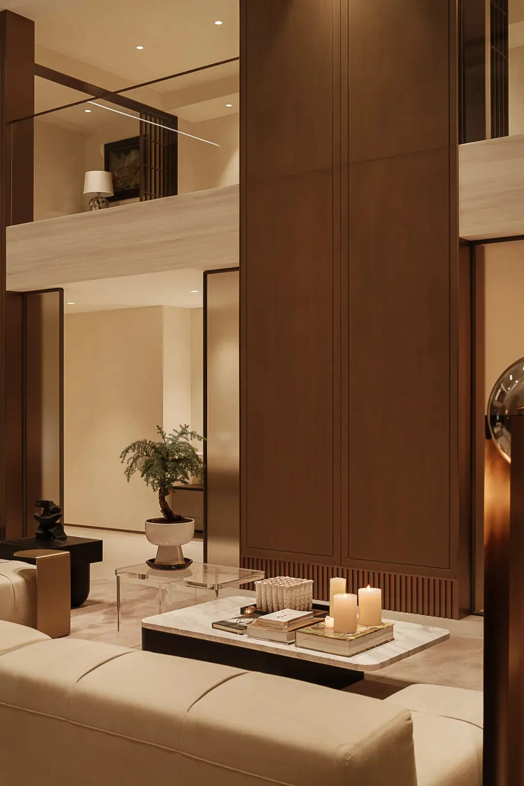 Neutral-toned leather furniture and a white marble coffee table in a modern living room