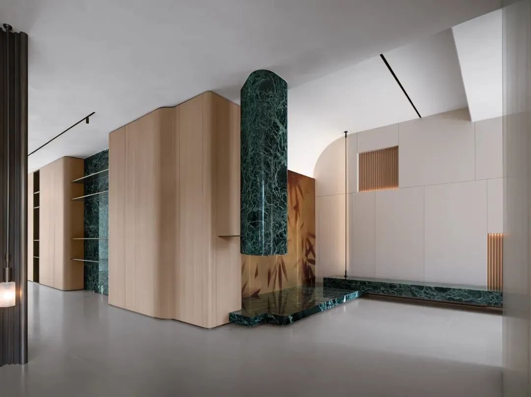 Modern lobby interior with marble and concrete elements.