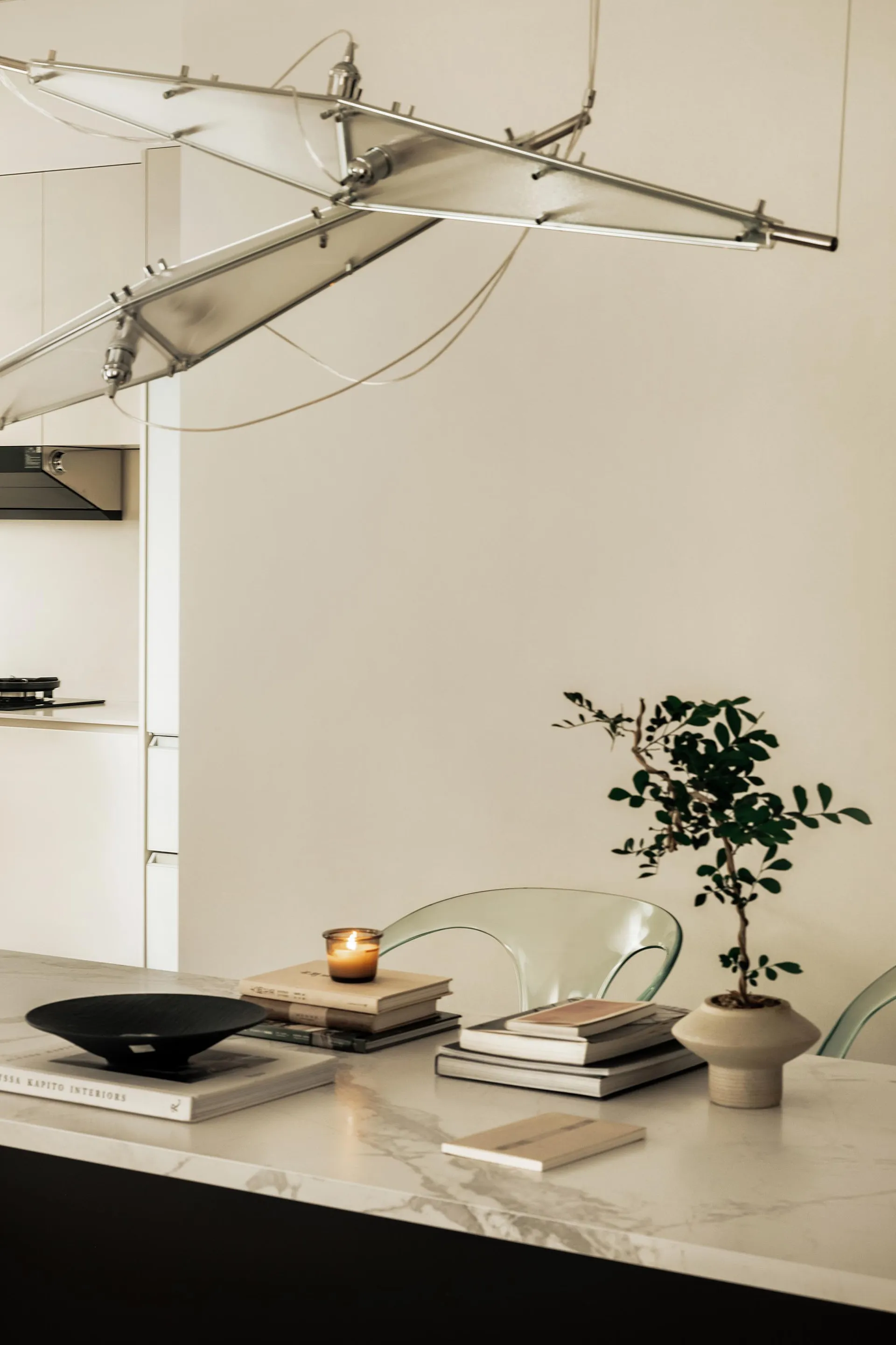 A modern kitchen with a marble floor plan