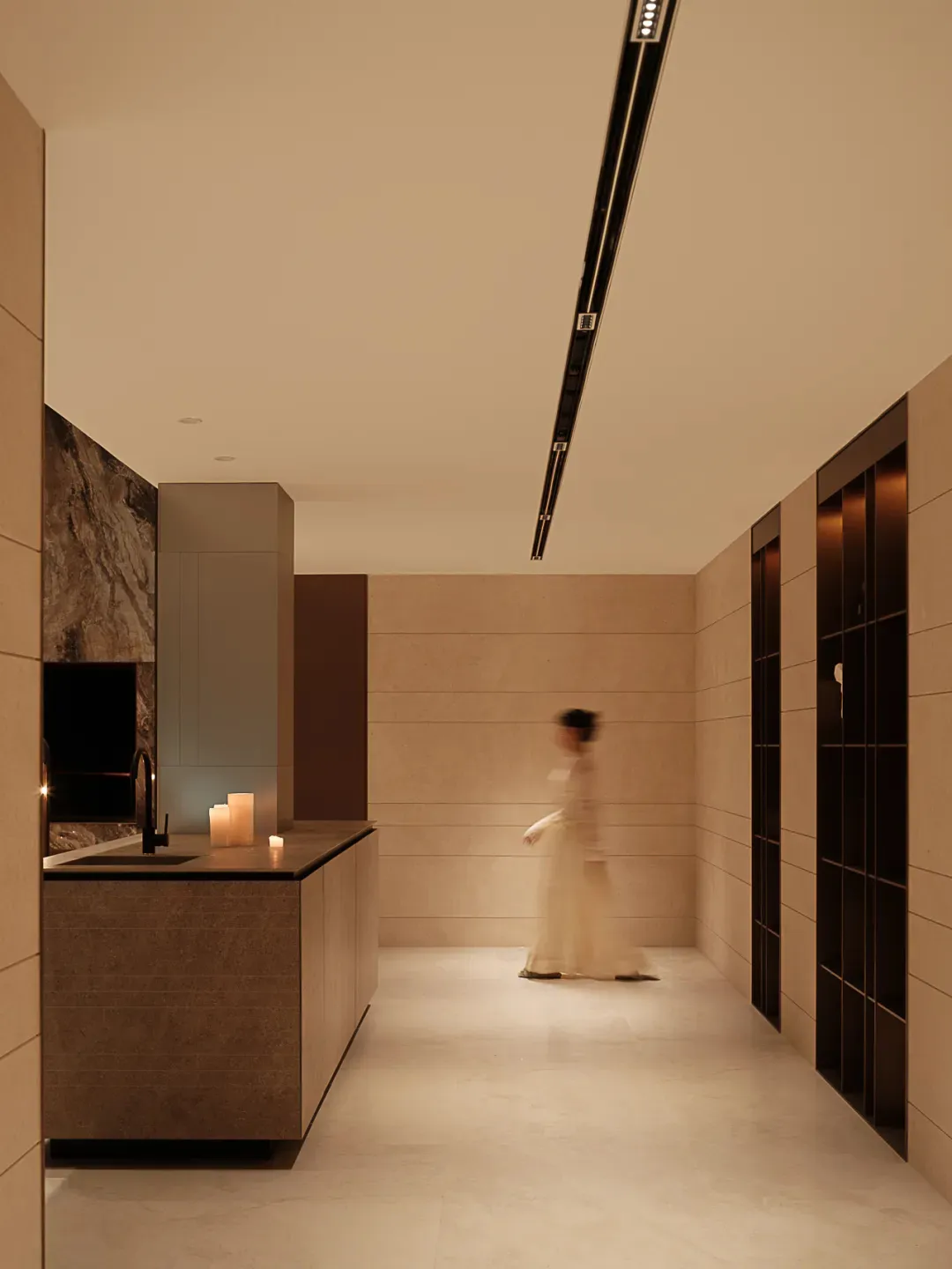 A minimalist kitchen with stone materials and modern design elements