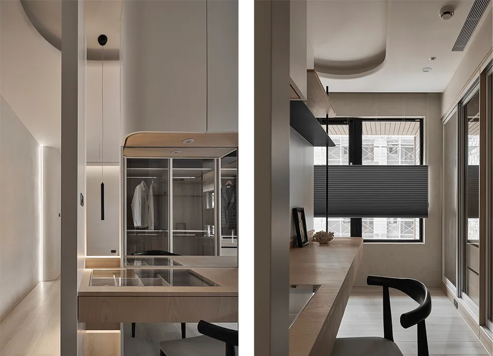 A modern minimalist residential interior featuring wooden furniture, glass cabinets, and metallic accents.