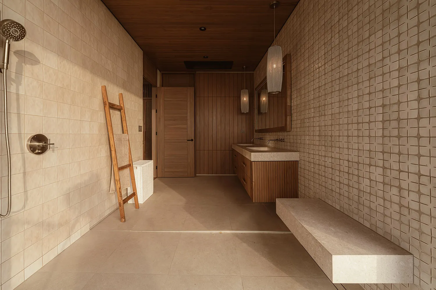 Modern bathroom featuring tiled walls and wooden accents