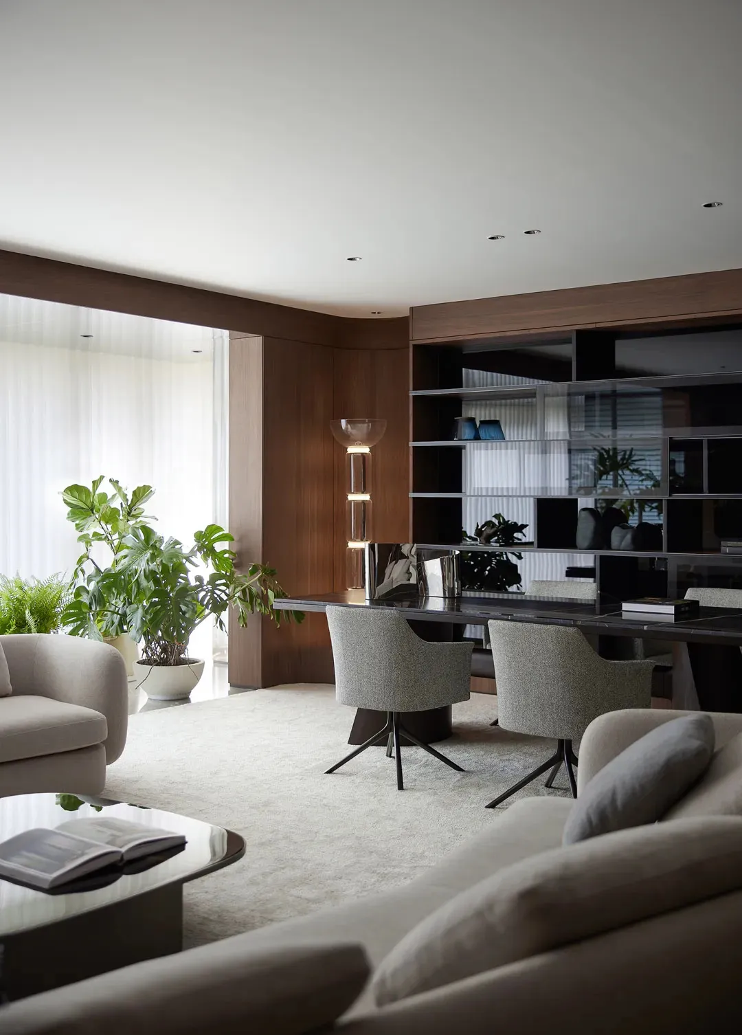 A modern living room featuring neutral furnishings and a minimalist design aesthetic.