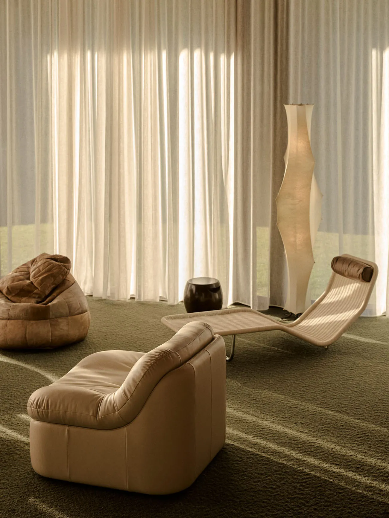 Contemporary living room with pastel-colored furniture and a sleek, modern design.