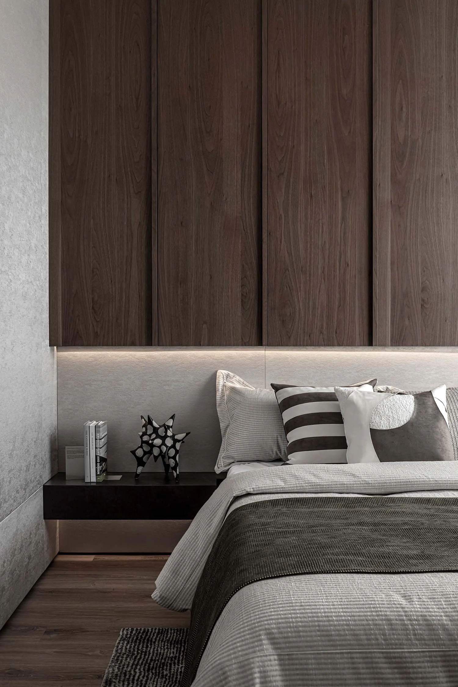 A modern bedroom with a wooden headboard, metal and leather accents, and a striped blanket.