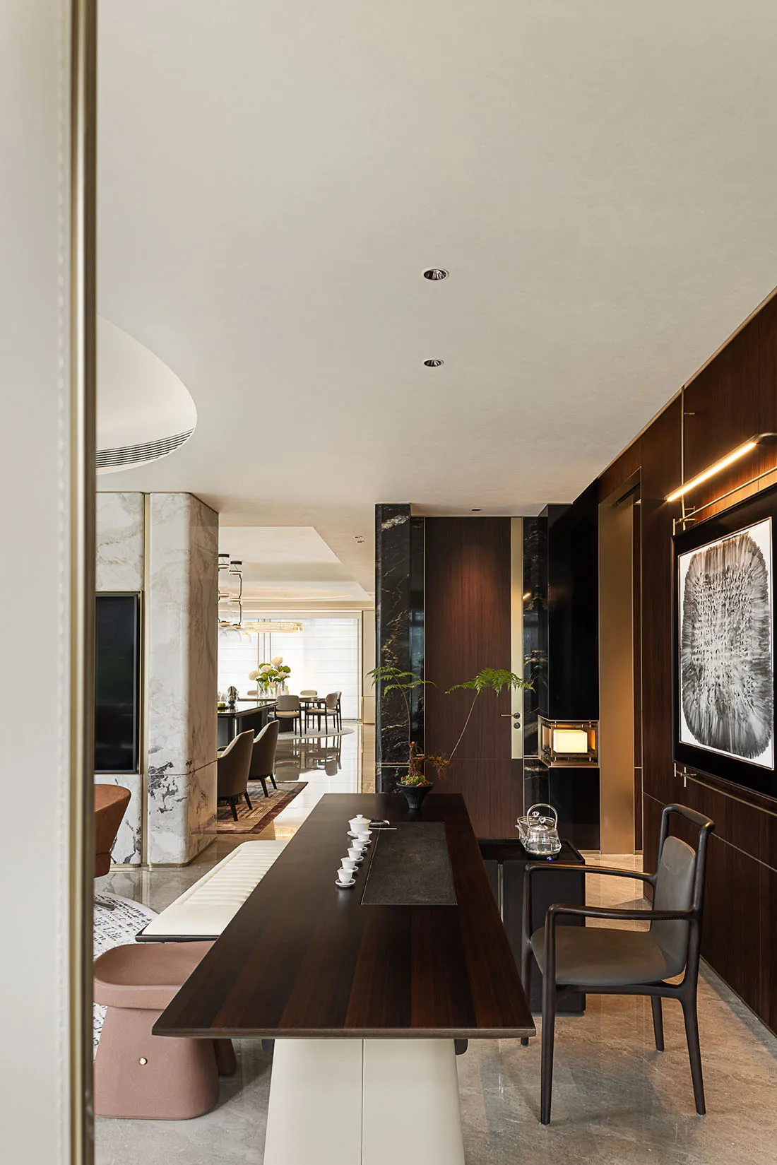 Modern living room featuring wood paneling and contemporary furniture.