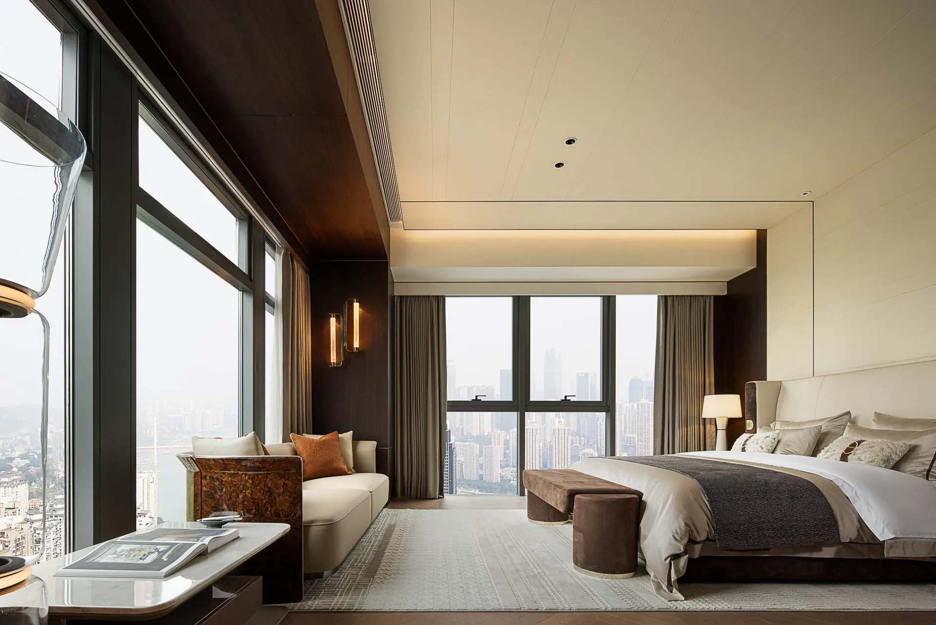 Modern residential bedroom featuring soft textiles, wood accents, and glass elements.