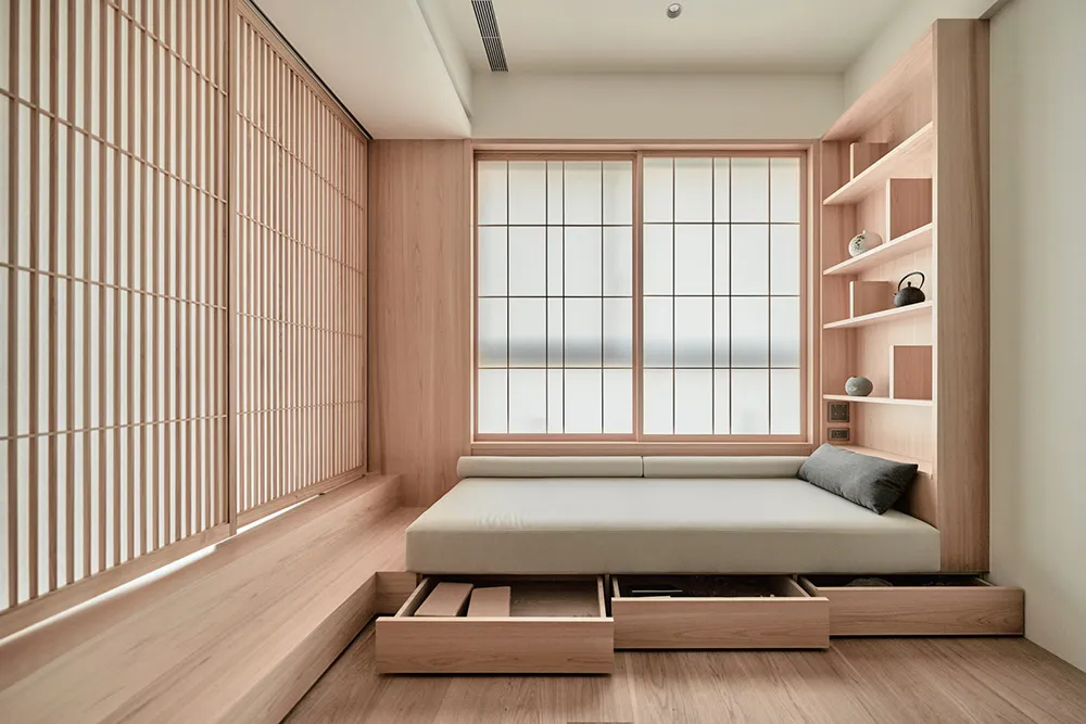 Minimalist bedroom with a floating bed, wooden shelves, and translucent sliding doors.