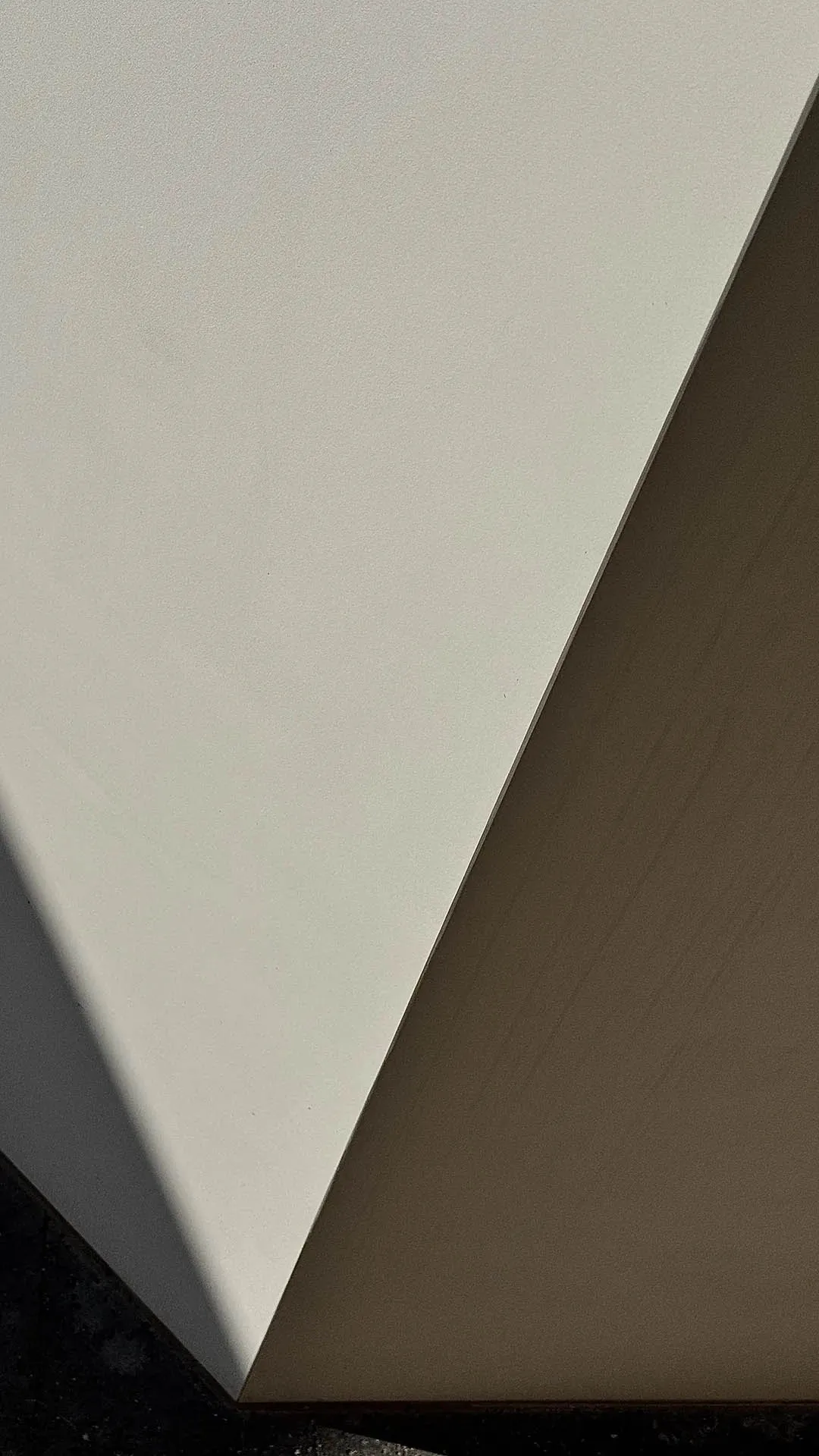 Modern interior design featuring textured white walls.