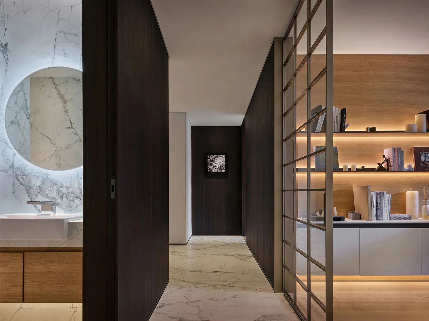 Modern luxury bathroom suite featuring marble and walnut wood materials.
