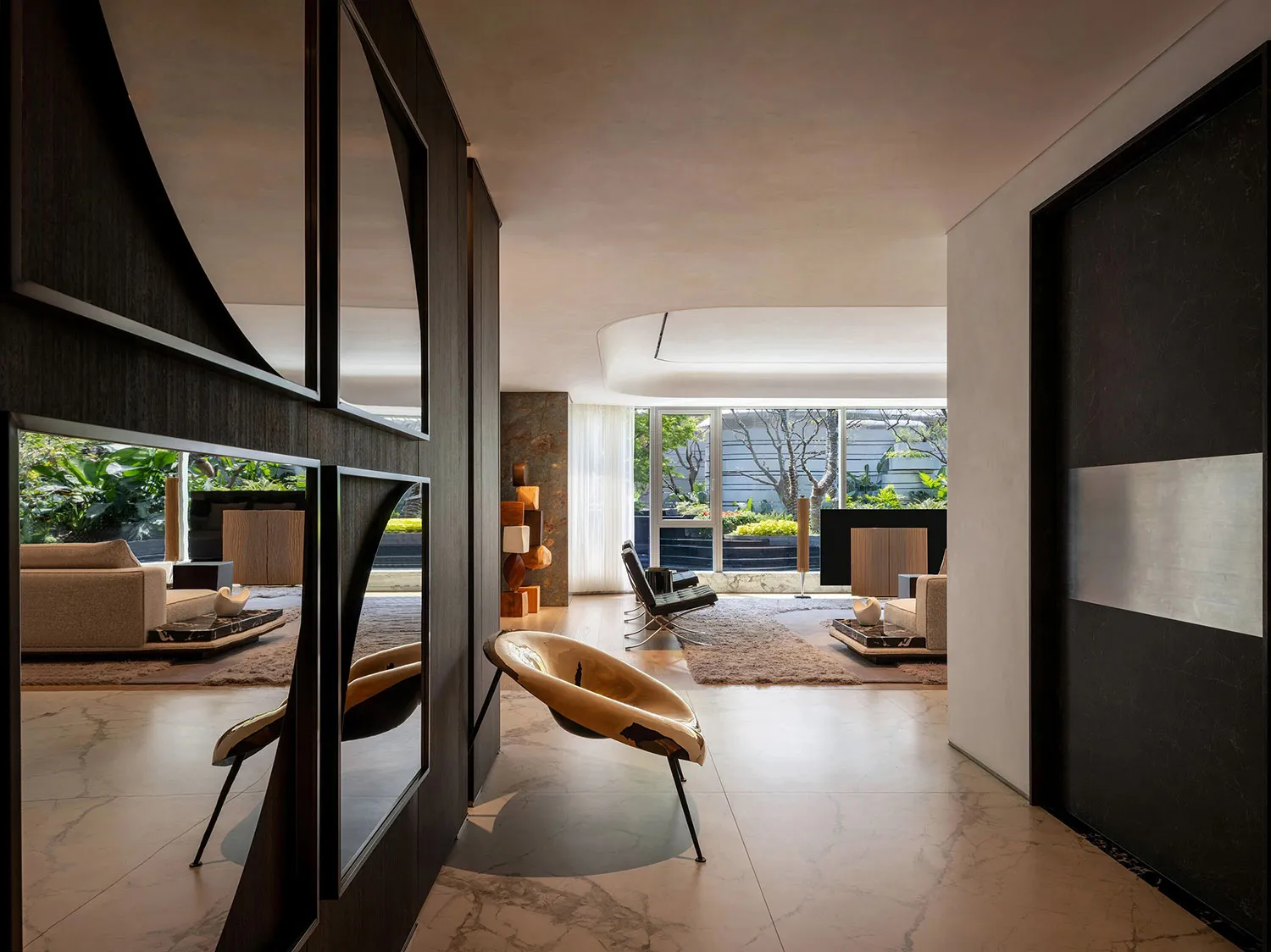 Modern living room with concrete and marble materials, featuring minimalist design.