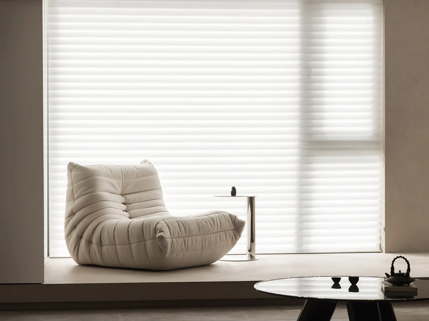 Modern minimalist living room featuring comfortable fabric seating and minimalist decor.