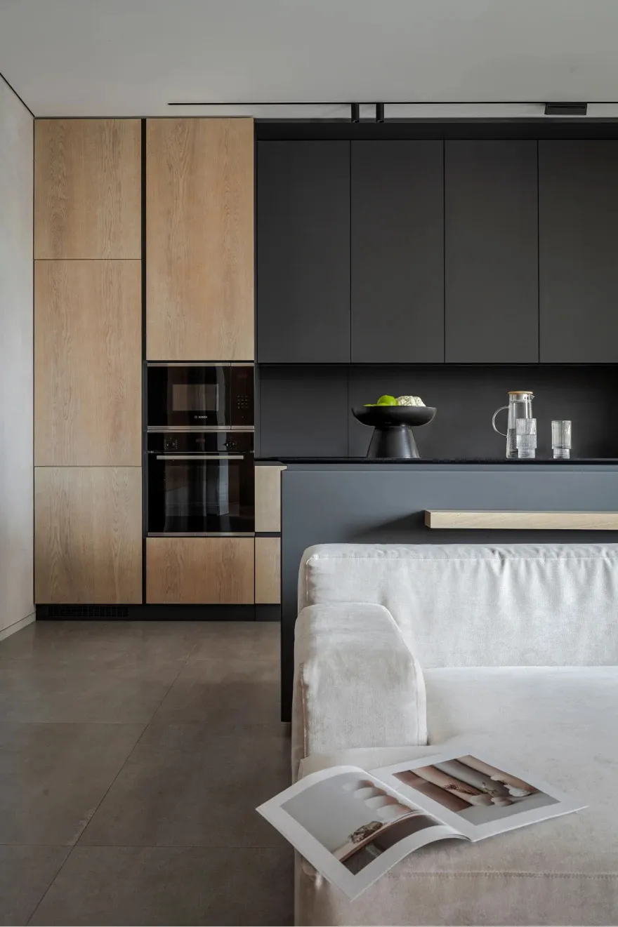 Contemporary kitchen with wooden cabinetry and metallic appliances