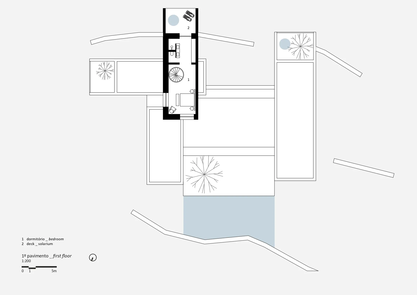 A modern floor plan on paper showing a bedroom and a solarium on the first floor.