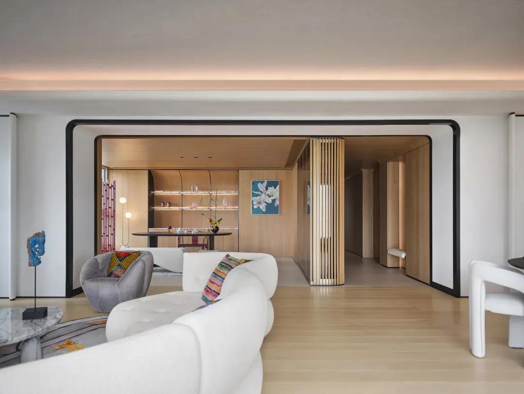 Modern living room with white couch and wooden accents