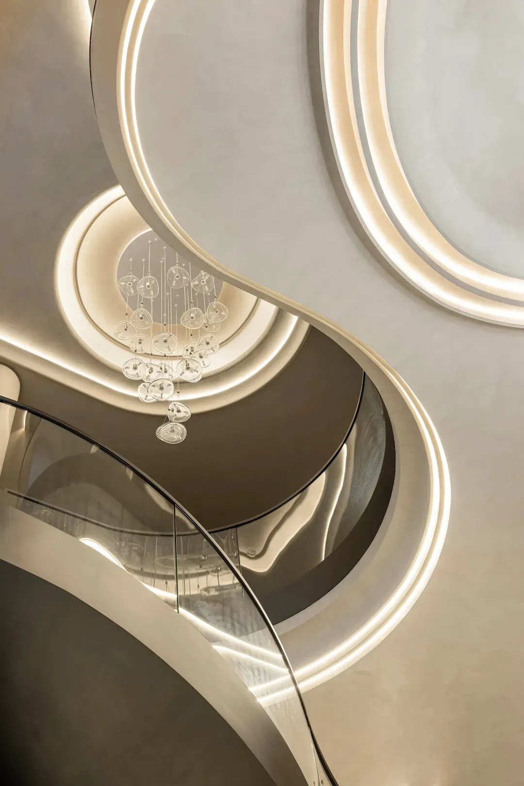 A sleek, modern staircase with glass circular elements and minimalistic design features.