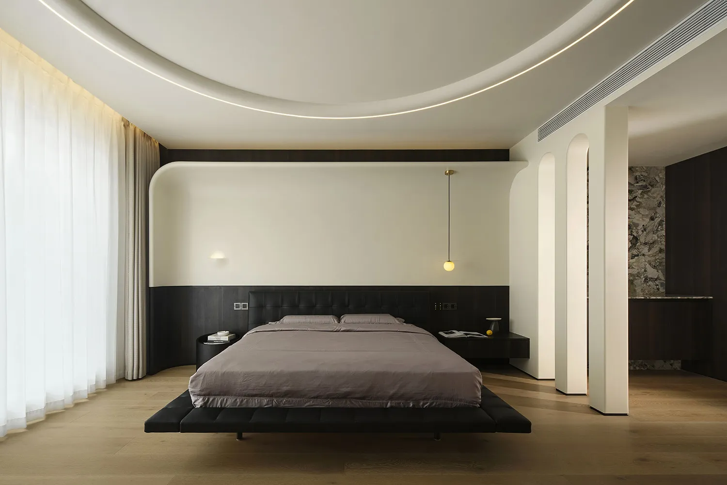 Modern minimalist bedroom with a floating platform bed, ceiling lights, and minimalistic design.