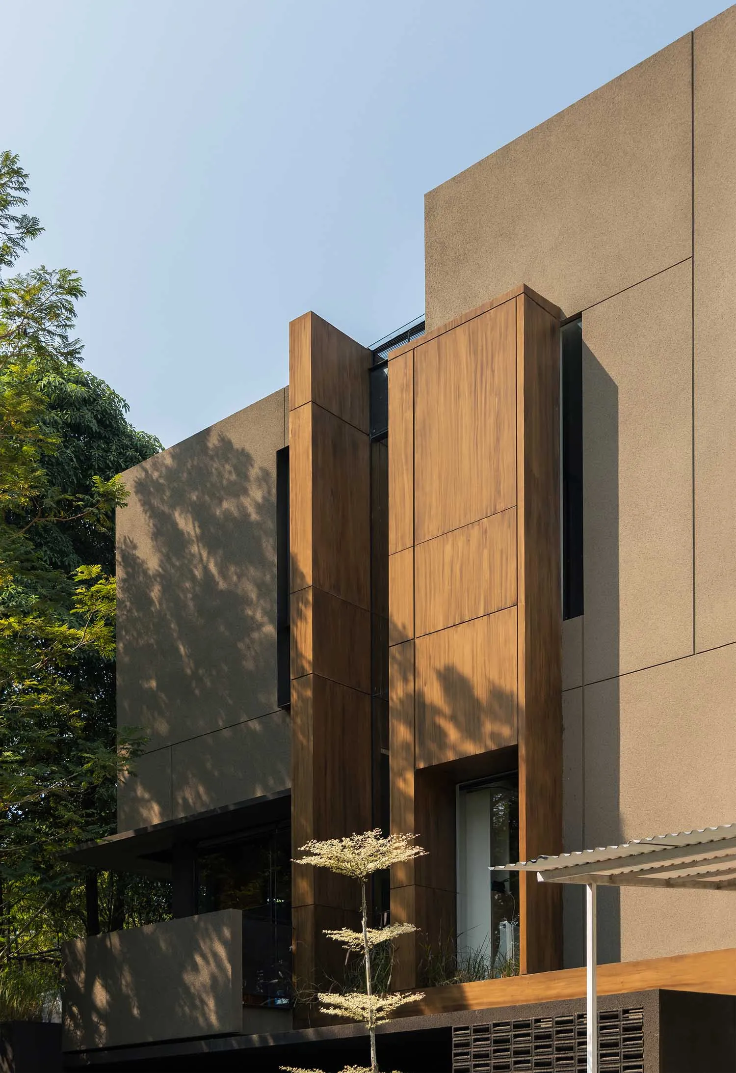 Modern building with wooden and concrete architectural elements.