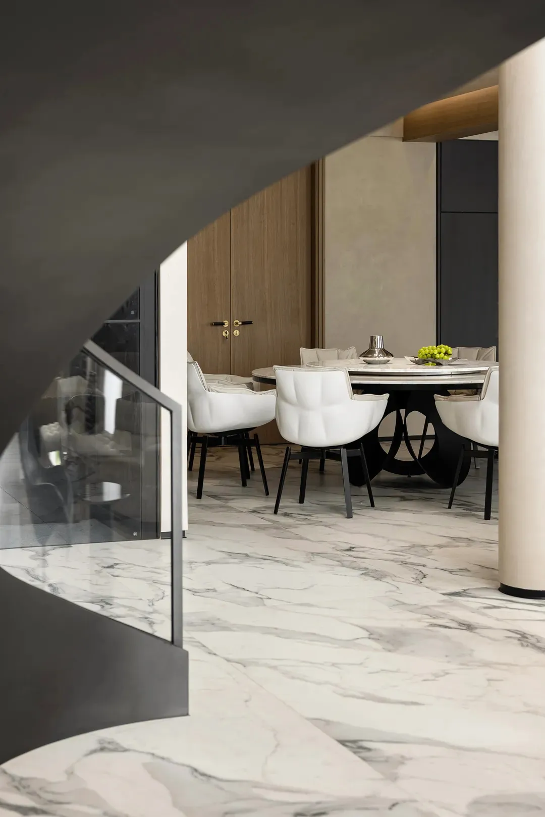 Modern dining room with marble floor and table.