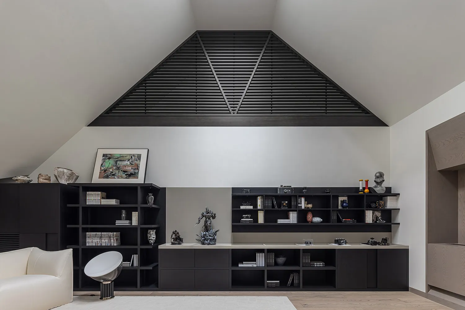 Minimalist living room featuring concrete flooring and wooden furniture.