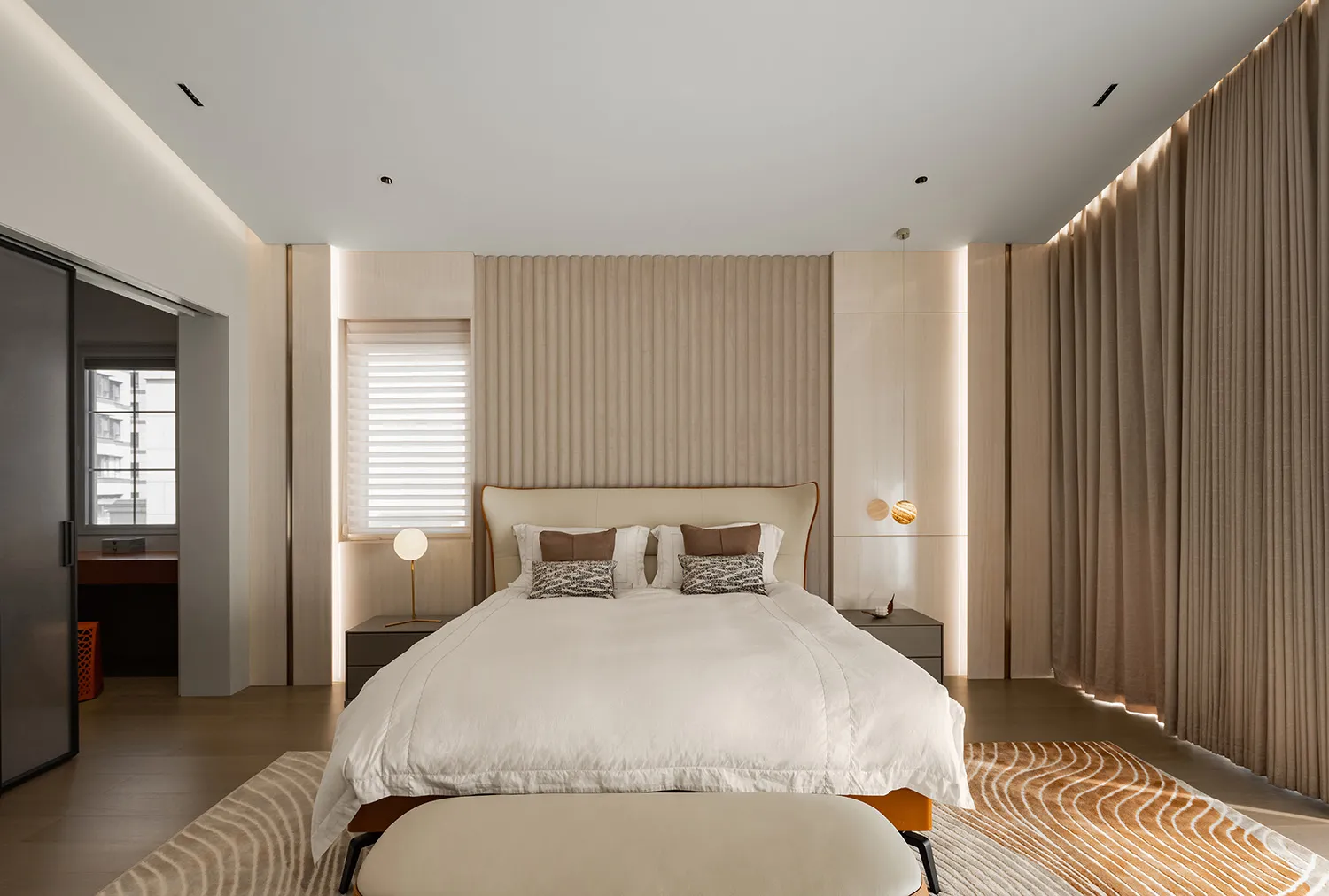 Modern minimalist bedroom with a wooden headboard and wall。