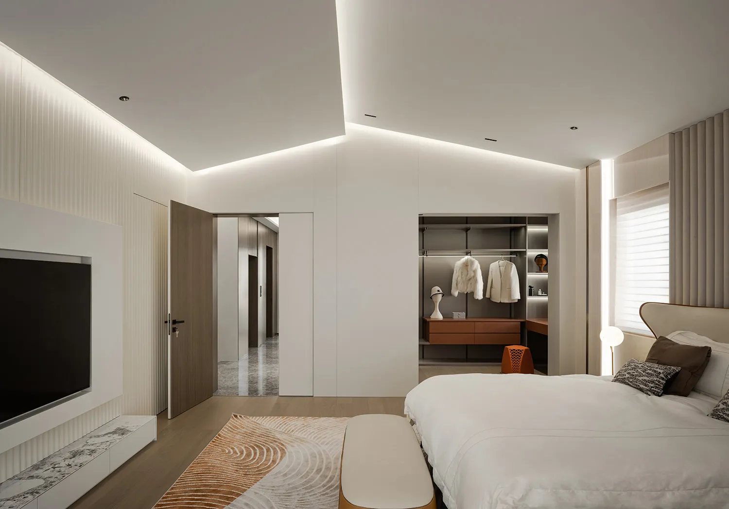 Spacious, minimalist bedroom with white walls, wooden floors, and marble accents.