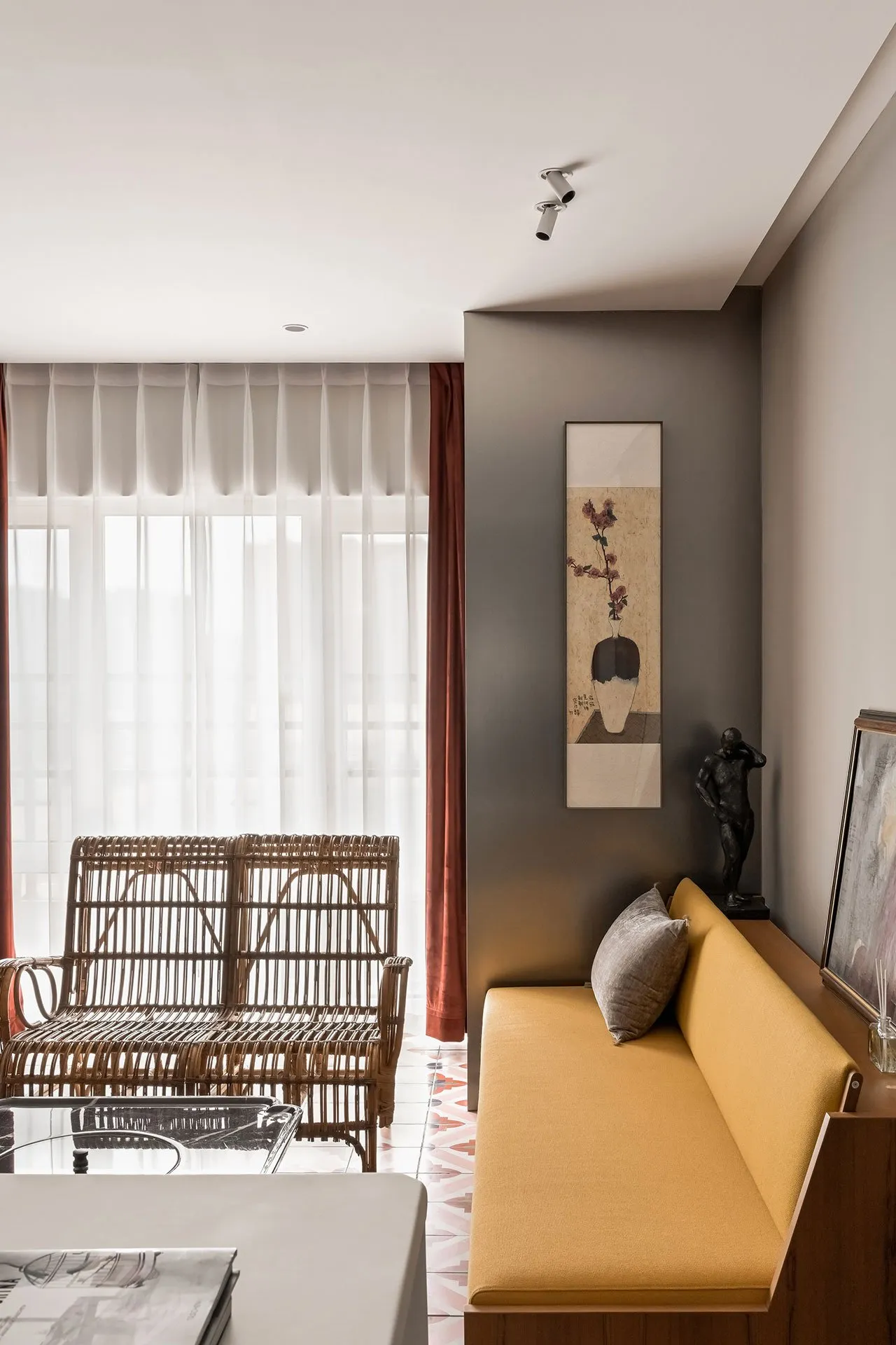 Living room featuring a modern couch with yellow upholstery, wooden accents, and a canvas wall art.