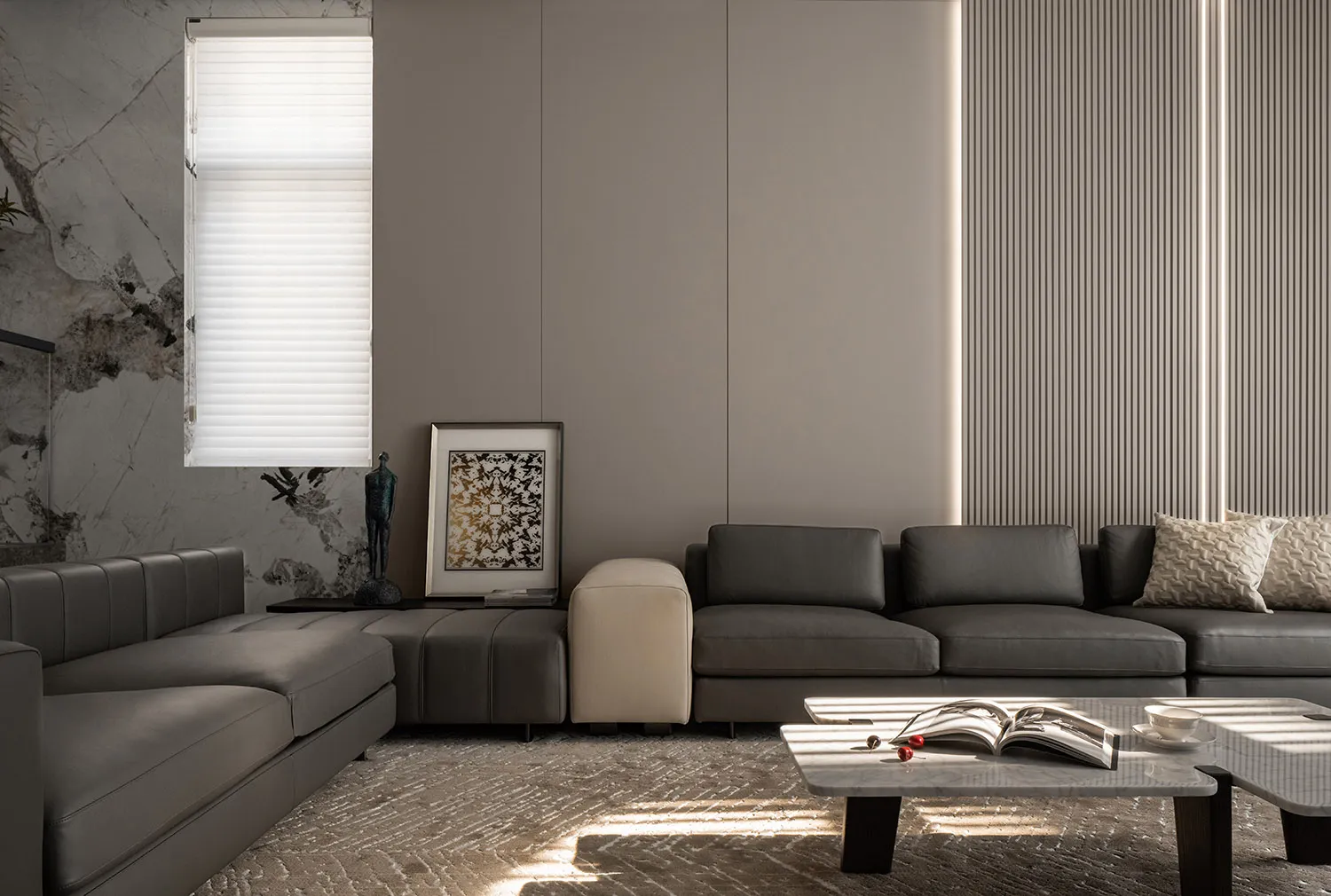 A modern minimalist living room featuring leather furniture and marble accents.