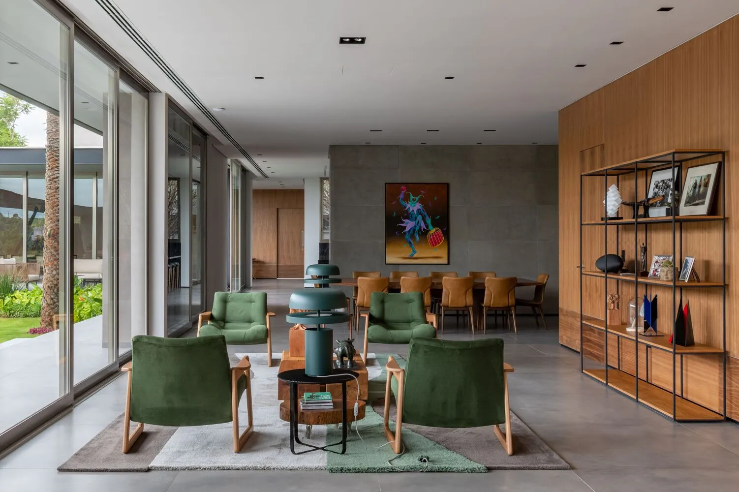 Contemporary living room with a concrete floor and minimalist design.