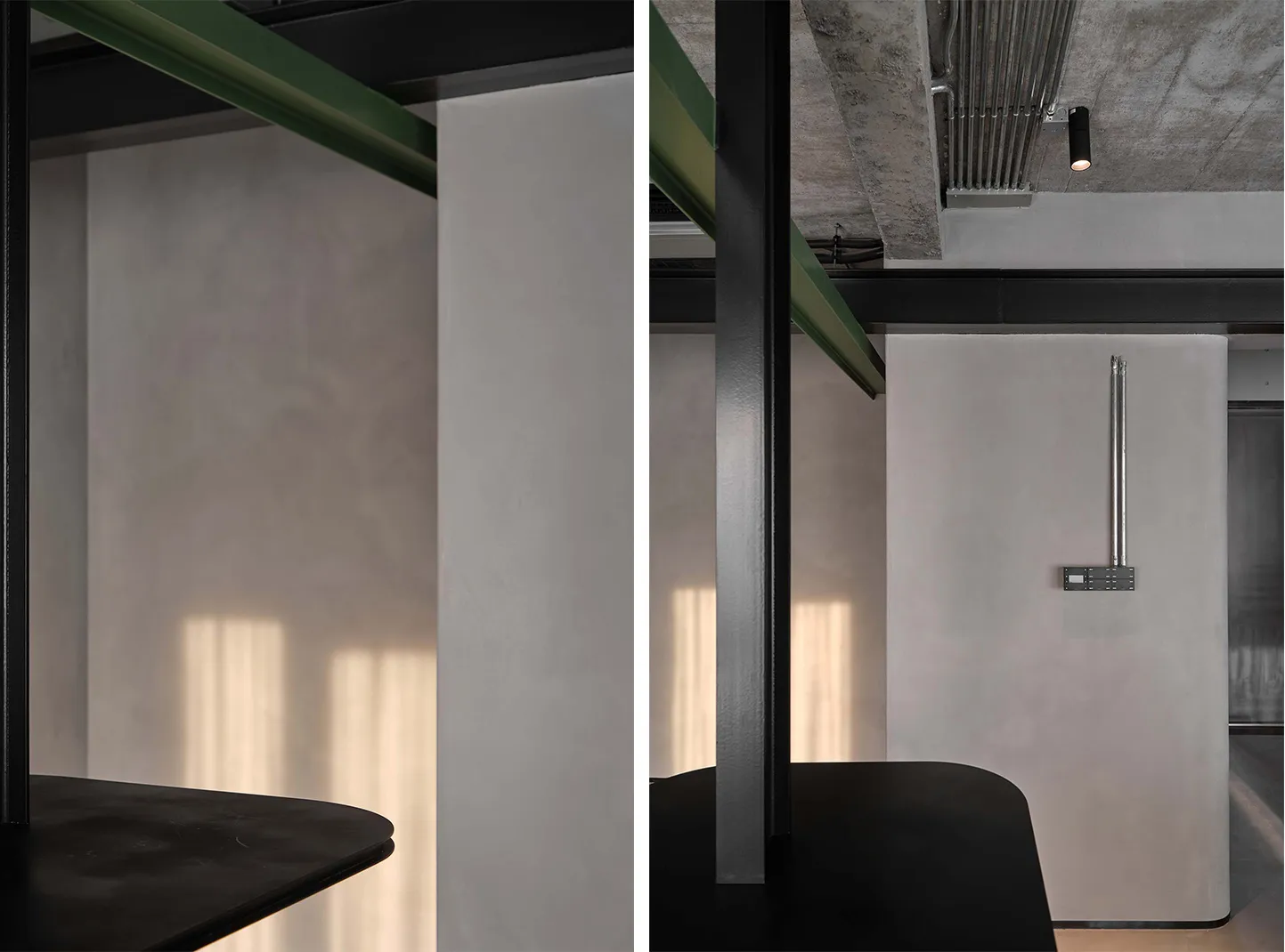 Clean, minimalist office interior with concrete walls and modern furniture.
