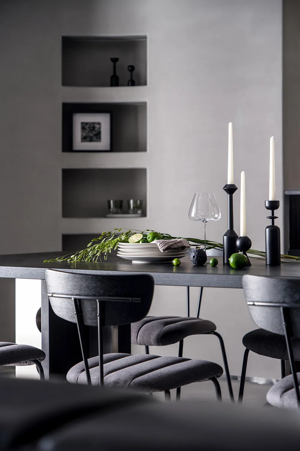 Modern dining room featuring ceramic and glass elements.