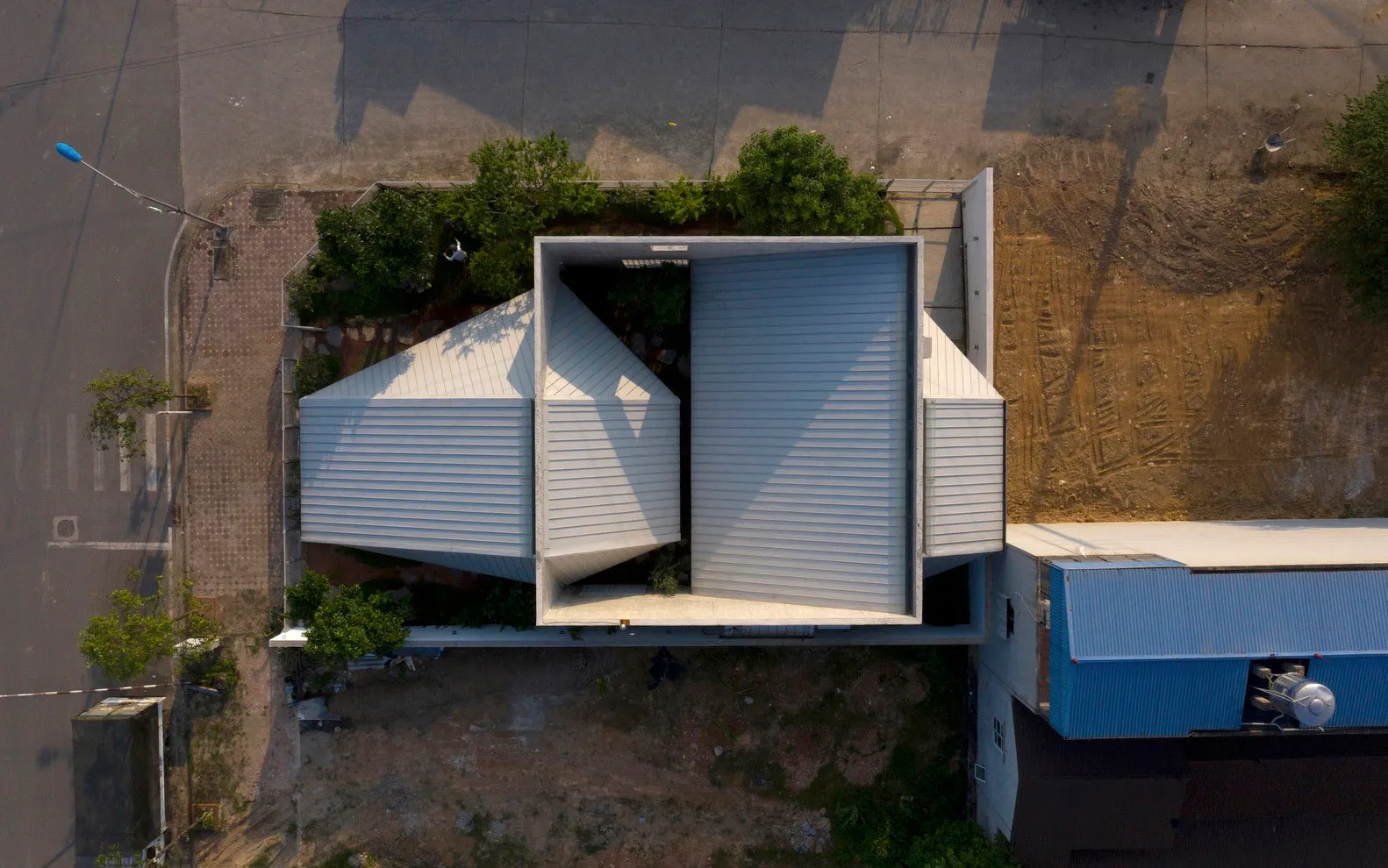 A modern metal building with geometric shapes and clean lines.