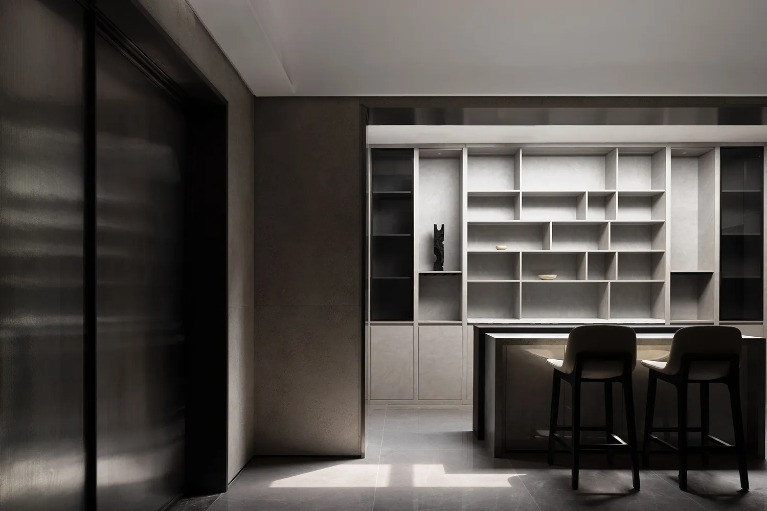 A modern interior featuring concrete, glass, and metal materials.