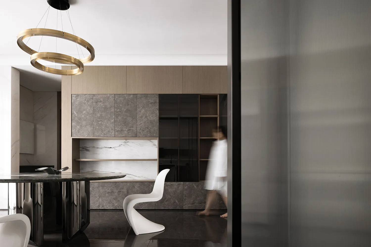 A modern interior design featuring a marble floor and contemporary furniture.