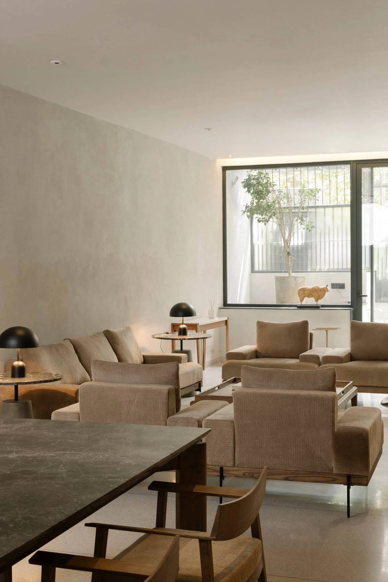 Modern living room featuring neutral-toned furniture and decor.