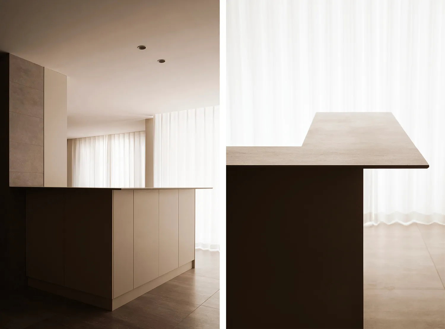 A modern kitchen with concrete countertops and minimalist design.