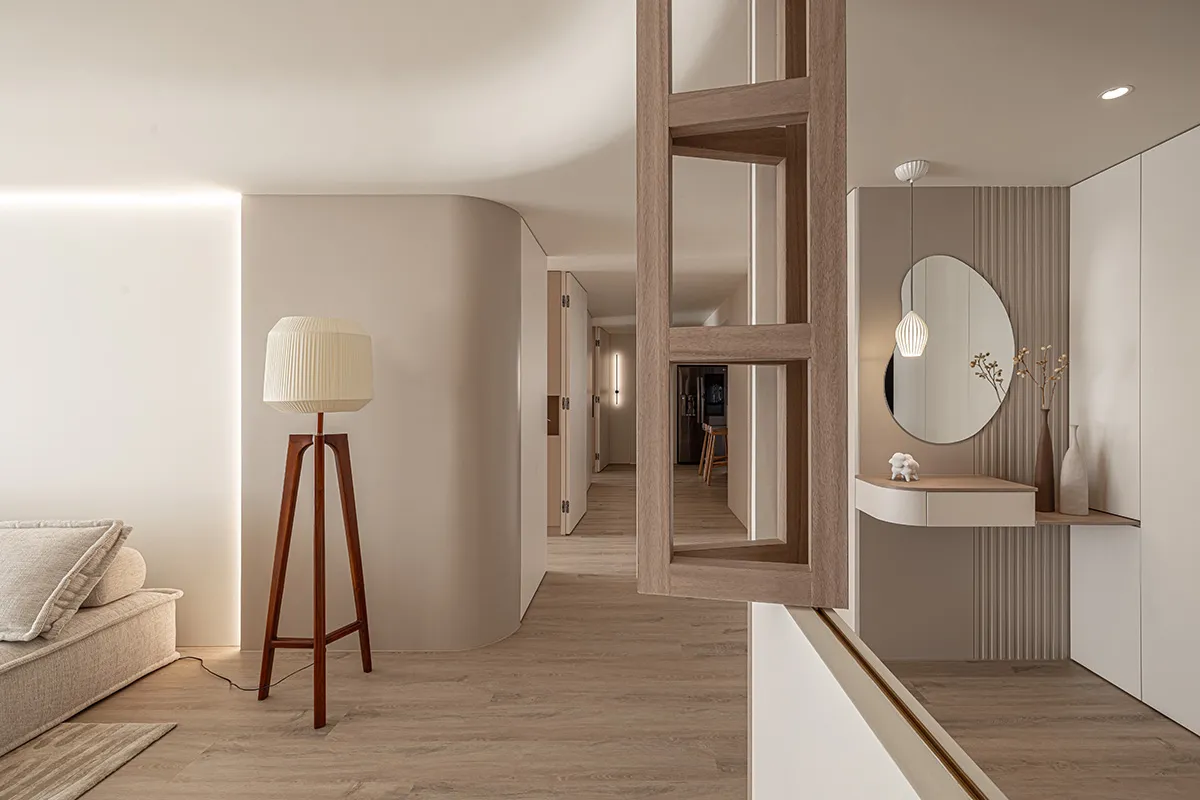 A modern residential living space featuring minimalist design elements and a neutral color palette.