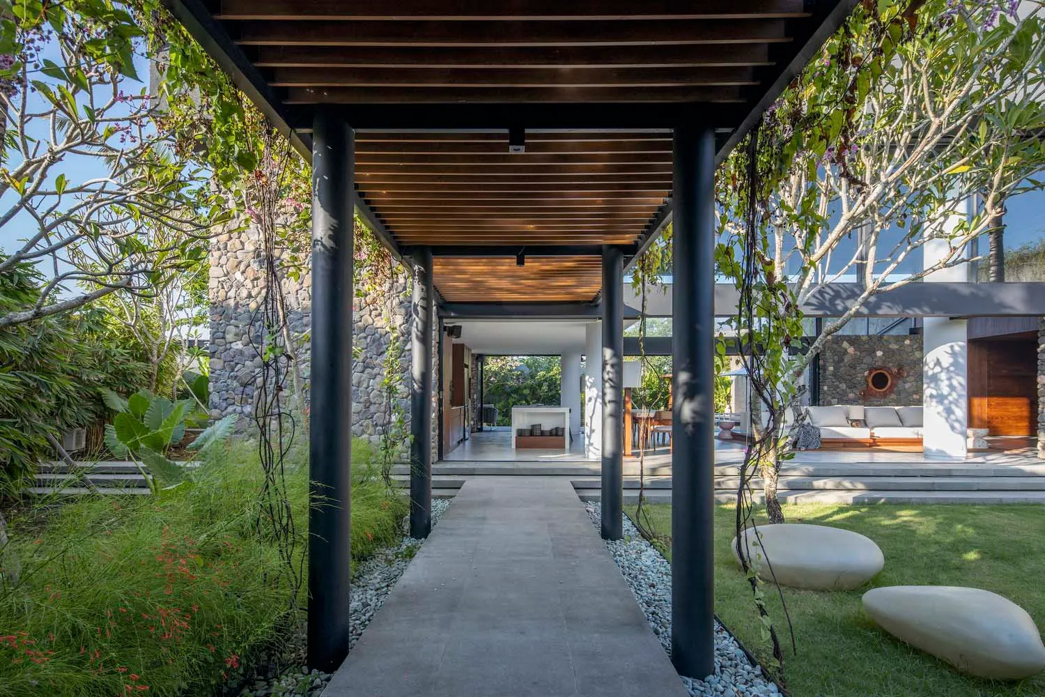 Modern minimalist entrance designed with concrete and wood materials.